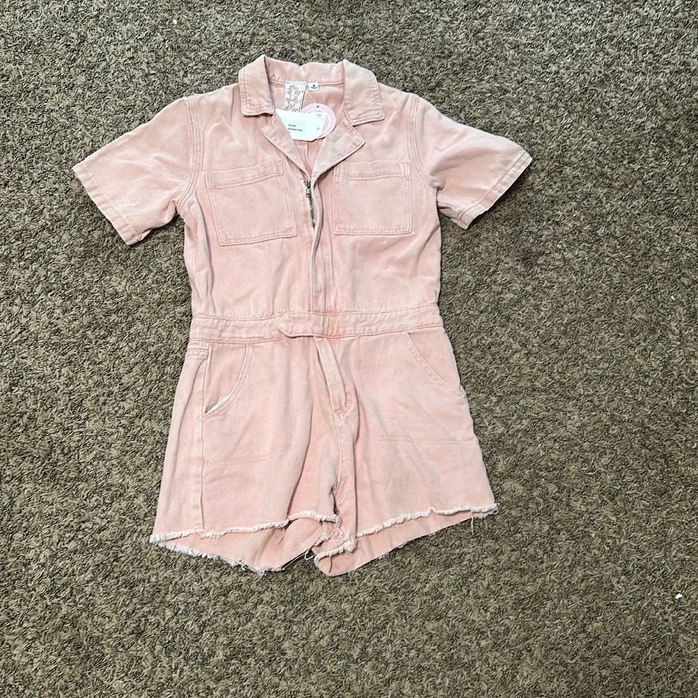 Light pink romper. Size medium. Never worn with tags!